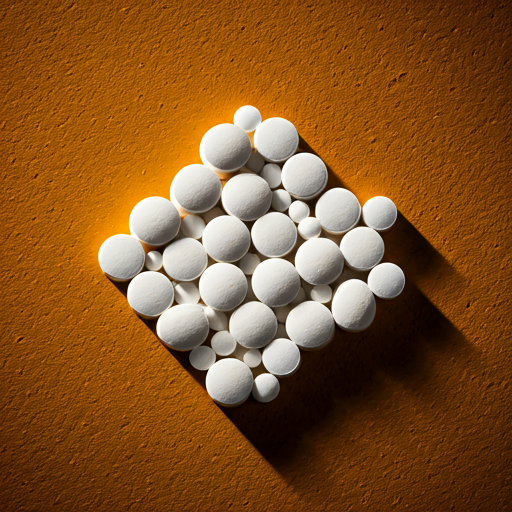 Abstract geometric arrangement of white pill tablets on a warm earthy background with soft shadows