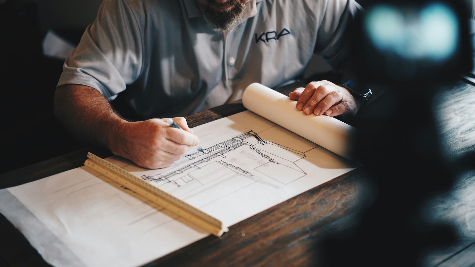 Architectural plans and project drawings representing property development bookkeeping and cost tracking